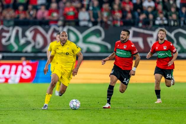 NIJMEGEN - FC Bodo Glimt verdediger Haitam Aleesami en N.E.C. Nijmegen aanvaller Dusan Tadic tijdens de UEFA Champions League wedstrijd tussen N.E.C. en FC Bodo Glimt in Gofferpark op 19 augustus 2026 in Nijmegen, Nederland. - *** NIJMEGEN FC Bodo Glimt defender Haitam Aleesami and NEC Nijmegen forward Dusan Tadic during the UEFA Champions League match between NEC and FC Bodo Glimt at Gofferpark on August 19, 2026, in Nijmegen, the Netherlands