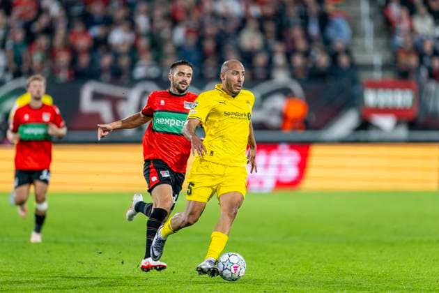 NIJMEGEN - N.E.C. Nijmegen aanvaller Dusan Tadic en FC Bodo Glimt verdediger Haitam Aleesami tijdens de UEFA Champions League wedstrijd tussen N.E.C. en FC Bodo Glimt in Gofferpark op 19 augustus 2026 in Nijmegen, Nederland. - *** NIJMEGEN N E C Nijmegen forward Dusan Tadic and FC Bodo Glimt defender Haitam Aleesami during the UEFA Champions League match between N E C and FC Bodo Glimt at Gofferpark on August 19, 2026, in Nijmegen, the Netherlands