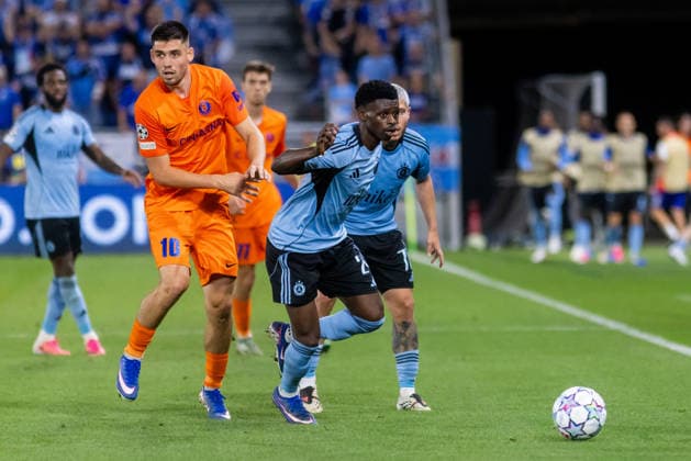 Svit Seslar of Celje and Camara Suleiman of SK Slovan Bratislava seen during UEFA Champions league first play-off game between teams of SK Slovan Bratislava and Celje (Dominika Kortvelyesiova Ball Raw Images) Bratislava Tehelne Pole stadium Slovakia Copyright: xDominikaxKortvelyesiovax DKOR1957