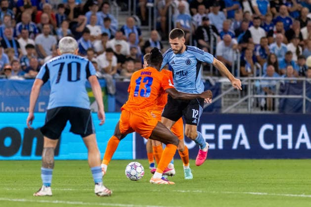 Cristian Martinez of SK Slovan Bratislava, Papa Daniel of Celje and Kenan Bajric of SK Slovan Bratislava seen during UEFA Champions league first play-off game between teams of SK Slovan Bratislava and Celje (Dominika Kortvelyesiova Ball Raw Images) Bratislava Tehelne Pole stadium Slovakia Copyright: xDominikaxKortvelyesiovax DKOR1977