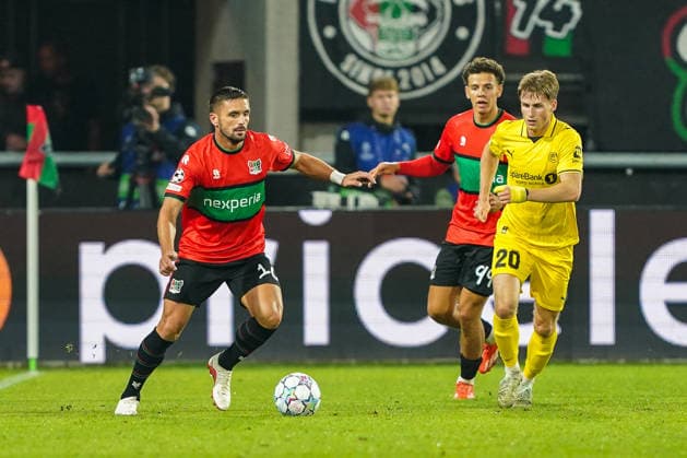 2026-08-19 NEC Nijmegen v Bodo Glimt - UEFA Champions League Play-offs - 1st leg NIJMEGEN, NETHERLANDS - AUGUST 19: Dusan Tadic of N.E.C. Nijmegen, Clement Bischoff of N.E.C. Nijmegen, Fredrik Sjovold of FK Bodo Glimt during the UEFA Champions League Play-offs - 1st leg match between NEC Nijmegen and Bodo Glimt at Goffertstadion on August 19, 2026 in Nijmegen, Netherlands. Nijmegen Goffertstadion Netherlands Content not available for redistribution in The Netherlands directly or indirectly through any third parties. Copyright: xAndrexWeeningx