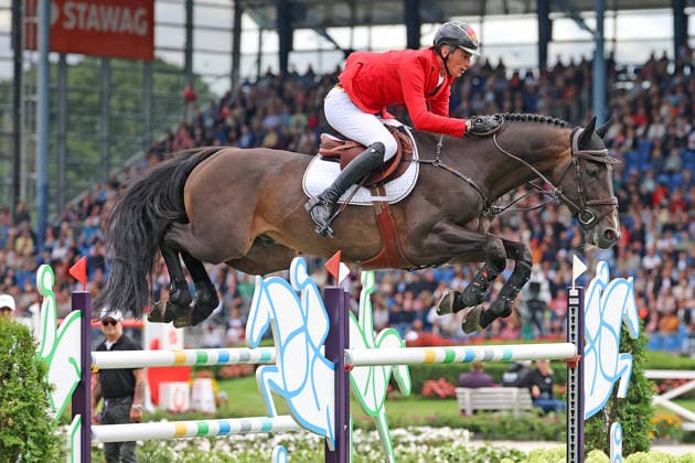 Daniel Deusser (GER, Deutschland) mit Pferd Otello de Guldenboom , Team Deutschland mit drei weiteren 0 Runden in der Führung , Springen, FEI Jumping World Championship, WM, Weltmeisterschaft , FEI Jumping World Championship Second Competition Team Final & Second Individual Qualifier, Mercedes-Benz Prize, Mercedes-Benz Prize, Einzel und Teamwertung, Jumping , AACHEN - FEI World Championships 2026, Weltfest des Pferdesports, Reitsport Weltmeisterschaft 2026, Aachen 2026, Welcome Home 2026, Aachener Soers, 11. bis 23. August 2026, Reitsport, 20.08.2026, Aachen Aachener Soers Deutschland *** Daniel Deusser (GER), Germany, riding Otello de Guldenboom; Team Germany remains in the lead with three additional clear rounds; Show Jumping, FEI Jumping World Championship; FEI Jumping World Championship Second Competition, Team Final, Second Individual Qualifier, Mercedes-Benz Prize, Mercedes-Benz Prize, Individual and Team Standings, Jumping, AACHEN FEI World Championships 2026, World Festival of Equestrian Sports, 2026 Equestrian World Championships, Aachen 2026, Welcome Home 2026, Aachen Soers, August 11–23, 2026, Equestrian Sports, August 20, 2026, Aachen Soers, Germany