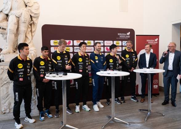 (260820) -- DUSSELDORF, Aug. 20, 2026 -- Table tennis, Tischtennis players American Kanak Jha (2nd L), Sweden s Anton Kallberg (3rd L), Germany s Qiu Dang (4th L), China s Li Yongyin (1st L) and Fan Zhendong (4th R), German table tennis star Timo Boll (5th L) and head coach Danny Heister (3rd R) attend a press conference, PK, Pressekonferenz after a welcoming ceremony in Dusseldorf, Germany, Aug. 20, 2026. Chinese table tennis star Fan Zhendong was officially unveiled by his new club Borussia Dusseldorf at a press conference here on Thursday, as the Olympic champion prepares for his second season in the German Table Tennis Bundesliga and another campaign in European competition. ) (SP)GERMANY-DUSSELDORF-TABLE TENNIS-FAN ZHENDONG-CEREMONY ZhangxHaofu 