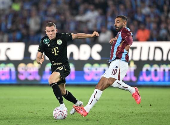 Trabzonspor v Ferencvaros - UEFA Europa League TRABZON, TURKIYE - AUGUST 20: Mohamed Salah (R) of Trabzonspor in action against Philippe Rommens (L) Ferencvaros during the first leg of the UEFA Europa League play-off round between Trabzonspor and Ferencvaros at Papara Park in Trabzon, Turkiye, on August 20, 2026. Hakan Burak Altunoz Anadolu Trabzon Turkey. Editorial use only. Please get in touch for any other usage.  Copyright: x2026xAnadoluxHakanxBurakxAltunozx