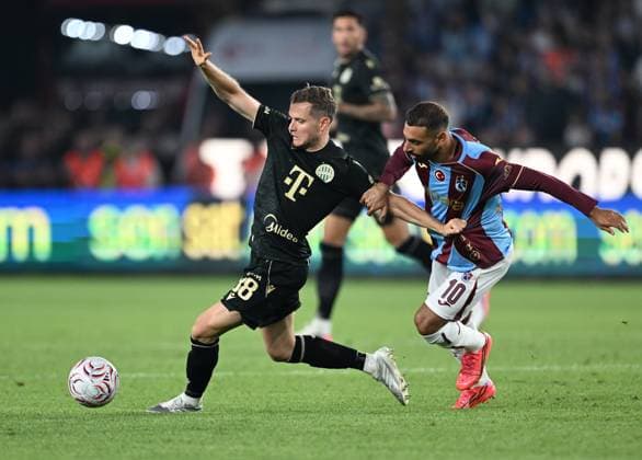 Trabzonspor v Ferencvaros - UEFA Europa League TRABZON, TURKIYE - AUGUST 20: Mohamed Salah (R) of Trabzonspor in action against Philippe Rommens (L) Ferencvaros during the first leg of the UEFA Europa League play-off round between Trabzonspor and Ferencvaros at Papara Park in Trabzon, Turkiye, on August 20, 2026. Hakan Burak Altunoz Anadolu Trabzon Turkey. Editorial use only. Please get in touch for any other usage.  Copyright: x2026xAnadoluxHakanxBurakxAltunozx