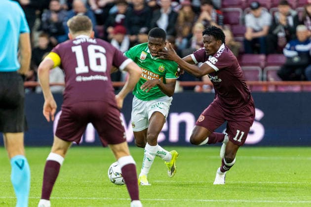 SOCCER - UEFA ECL, Hearts vs Rapid EDINBURGH,SCOTLAND,20.AUG.26 - SOCCER - UEFA Conference League, play-off, Heart of Midlothian FC vs SK Rapid Wien. Image shows Romeo Amane (Rapid) and Pierre Landry Kabore (Hearts).  GEPAxpictures xPhilippxBrem