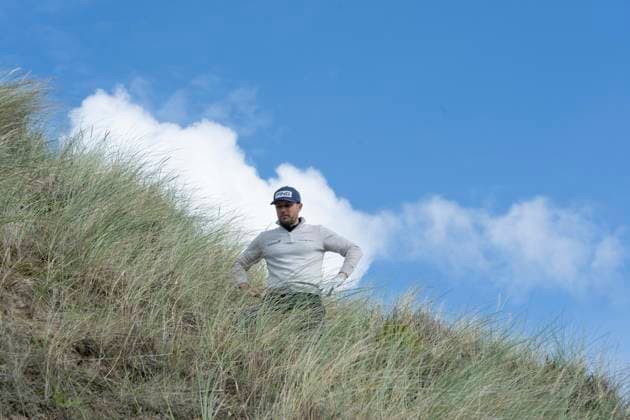 BALMEDIE, SCOTLAND - AUG 20: Joel Girrbach (CHE) assesses his lie in the sand dunes above the 10th green during Round 1 at the 2026 Nexo Championship at the Trump International Golf Links, Balmedie on August 20, 2026 in Aberdeenshire, Scotland The 2026 Nexo Championship