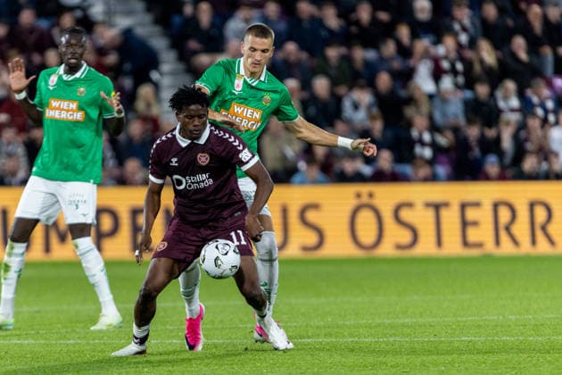 SOCCER - UEFA ECL, Hearts vs Rapid EDINBURGH,SCOTLAND,20.AUG.26 - SOCCER - UEFA Conference League, play-off, Heart of Midlothian FC vs SK Rapid Wien. Image shows Pierre Landry Kabore (Hearts) and Nenad Cvetkovic (Rapid).  GEPAxpictures xPhilippxBrem