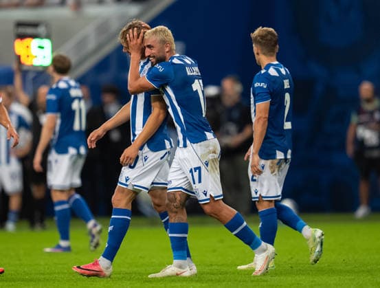Allahyar Sayyadmanesh and Robert Gumny of KKS Lech Poznan celebrate during UEFA Europa League - Playoff Round season 26 27 match between teams of KKS Lech Poznan and FC Thun (Ruslan Taran Ball Raw Images) Poznan Enea Stadium Poland Copyright: xRuslanxTaranx _IMG7682
