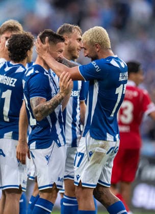 Allahyar Sayyadmanesh and Radoslaw Murawski of KKS Lech Poznan celebrate during UEFA Europa League - Playoff Round season 26 27 match between teams of KKS Lech Poznan and FC Thun (Ruslan Taran Ball Raw Images) Poznan Enea Stadium Poland Copyright: xRuslanxTaranx _IMG5227