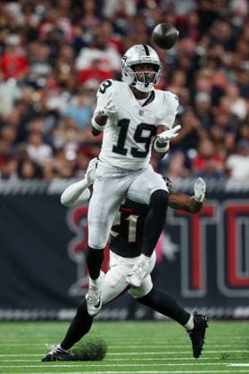 HOUSTON, TX - AUGUST 20: Wide receiver Malik Benson 19 of the Las Vegas Raiders leaps for a reception in front of safety Kaevon Merriweather 21 of the Houston Texans during the NFL, American Football Herren, USA preseason game between the Houston Texans and the Las Vegas Raiders on August 20, 2026, at Reliant Stadium in Houston, TX. (Photo by David Buono Icon Sportswire) NFL: AUG 20 Raiders at Texans EDITORIAL USE ONLY Icon260820027