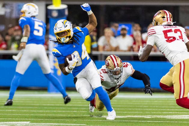 August 20, 2026, Inglewood, California, USA: Los Angeles Chargers Running Back Keaton Mitchell (34) runs the ball fighting off pressure from San Francisco 49ers Linebacker Garrett Wallow (49) during an NFL, American Football Herren, USA football preseason game, in Inglewood, Calif. on Thursday August 20, 2026. Inglewood USA - ZUMAc68_ 20260820_zaf_c68_014 Copyright: xRingoxChiux