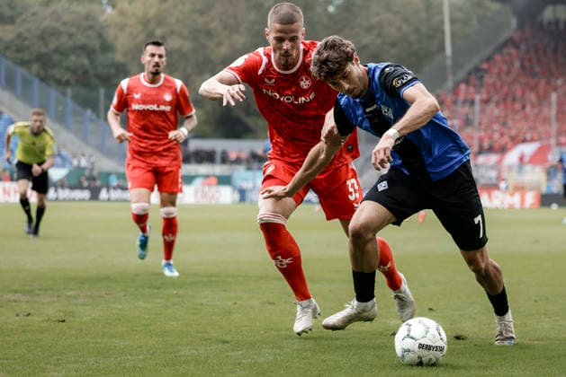 21.08.2026, xhettx, Fussball DFB Pokal 1.Runde, SV Waldhof Mannheim - 1.FC Kaiserslautern v.l. Jan Elvedi (1. FC Kaiserslautern, 33) und Lovis Bierschenk (SV Waldhof Mannheim, 7) im Zweikampf (DFL DFB REGULATIONS PROHIBIT ANY USE OF PHOTOGRAPHS as IMAGE SEQUENCES and or QUASI-VIDEO) *** August 21, 2026, xhettx, Soccer DFB Cup 1st Round, SV Waldhof Mannheim 1 FC Kaiserslautern v l Jan Elvedi 1 FC Kaiserslautern, 33 and Lovis Bierschenk, SV Waldhof Mannheim, 7 in a tackle. DFL and DFB regulations prohibit any use of photographs as image sequences and or quasi-video.