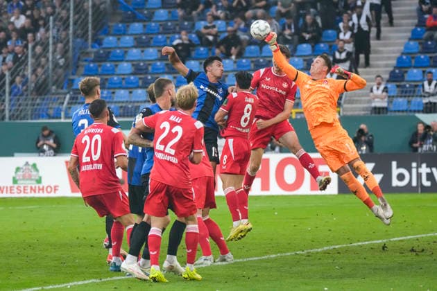 Julian Krahl (Torhüter, FCK, 1) klärt den Ball, Aktion, Action, Spielszene, im Strafraum, Strafraumszene, 21.08.2026, Mannheim (Deutschland), Fussball, DFB-Pokal, 1. Runde, SV Waldhof Mannheim - 1. FC Kaiserslautern, DFB DFL REGULATIONS PROHIBIT ANY USE OF PHOTOGRAPHS AS IMAGE SEQUENCES AND OR QUASI-VIDEO. *** Julian Krahl, goalkeeper, FCK, 1 clears the ball, action, play, in the penalty area, penalty area scene, August 21, 2026, Mannheim, Germany, soccer, DFB Cup, 1st round, SV Waldhof Mannheim vs. 1. FC Kaiserslautern, DFB and DFL regulations prohibit any use of photographs as image sequences and or quasi-video xozx