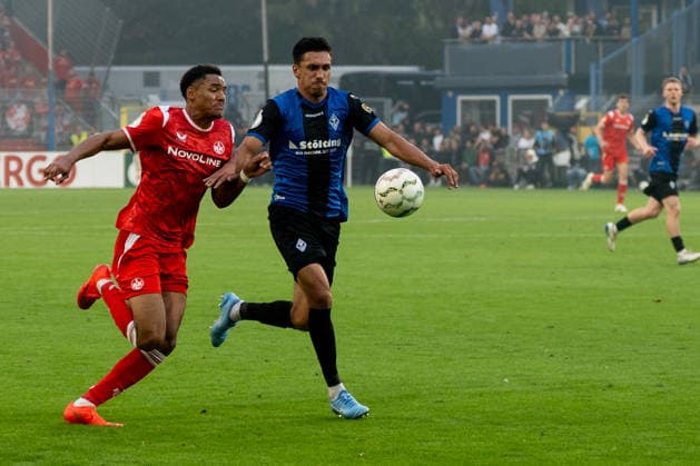 DFB-Pokal: SV Waldhof Mannheim vs 1. FC Kaiserslautern, 21.08.2026 Zweikampf zwischen Claudio Kammerknecht (SV Waldhof Mannheim, 15) und Thierry Fidjeu-Tazemeta (1. FC Kaiserslautern, 39) DFB-Pokal: SV Waldhof Mannheim vs 1. FC Kaiserslautern, Carl-Benz-Stadion, 21.08.2026 DFB DFL REGULATIONS PROHIBIT ANY USE OF PHOTOGRAPHS AS IMAGE SEQUENCES AND OR QUASI-VIDEO. *** DFB Cup: SV Waldhof Mannheim vs. 1 FC Kaiserslautern, August 21, 2026: A tackle between Claudio Kammerknecht (SV Waldhof Mannheim, No. 15) and Thierry Fidjeu Tazemeta (1 FC Kaiserslautern, No. 39) in the DFB Cup match between SV Waldhof Mannheim and 1 FC Kaiserslautern at Carl Benz Stadium, August 21, 2026 DFB and DFL regulations prohibit any use of photographs as image sequences and or quasi-video. Copyright: xBEAUTIFULxSPORTS Hillx