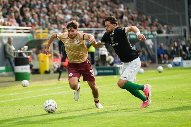 Deutschland: DFB Pokal 2026 2027 1.Runde, SC Preußen Münster vs Karlsruher SC, Freitag 21.08.2026 LVM-Preußenstadion (Münster, Nordrhein-Westfalen, Deutschland) Zweikampf Charalambos Makridis (SC Preußen Münster, 14) Rafael Pinto Pedrosa (Karlsruher SC, 36) *** Germany DFB Cup 2026–2027, First Round: SC Preußen Münster vs. Karlsruher SC, Friday, August 21, 2026, LVM Preußenstadion, Münster, North Rhine-Westphalia, Germany; Tackle: Charalambos Makridis (SC Preußen Münster), 14; Rafael Pinto Pedrosa (Karlsruher SC), 36 Copyright: xMerlexKölkingx