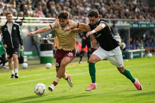 Deutschland: DFB Pokal 2026 2027 1.Runde, SC Preußen Münster vs Karlsruher SC, Freitag 21.08.2026 LVM-Preußenstadion (Münster, Nordrhein-Westfalen, Deutschland) Zweikampf Charalambos Makridis (SC Preußen Münster, 14) Rafael Pinto Pedrosa (Karlsruher SC, 36) *** Germany DFB Cup 2026–2027, First Round: SC Preußen Münster vs. Karlsruher SC, Friday, August 21, 2026, LVM Preußenstadion, Münster, North Rhine-Westphalia, Germany; Tackle: Charalambos Makridis (SC Preußen Münster), 14; Rafael Pinto Pedrosa (Karlsruher SC), 36 Copyright: xMerlexKölkingx