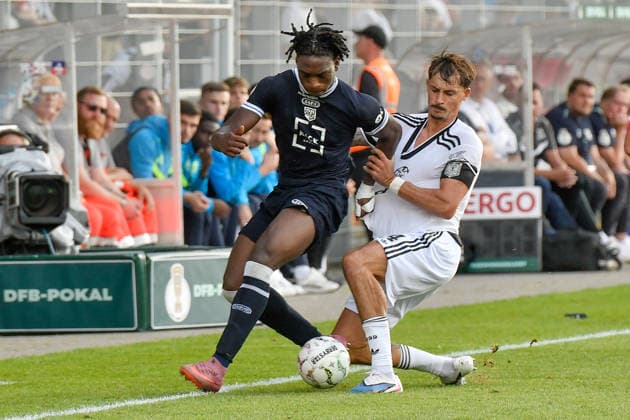 v. li. im Zweikampf Farid Omorou (St. Tönis 15) Robin Koch (Eintracht Frankfurt 4) 21.08.2026 ¢ Fussball ¢ SC St. Tönis vs Eintracht Frankfurt, Grotenburg-Stadion, Krefeld, DFB DFL REGULATIONS PROHIBIT ANY USE OF PHOTOGRAPHS AS IMAGE SEQUENCES AND OR QUASI-VIDEO NRW Germany *** From left in a one-on-one: Farid Omorou, St. Tönis 15; Robin Koch, Eintracht Frankfurt 4; August 21, 2026 ¢ Soccer ¢ SC St. Tönis vs. Eintracht Frankfurt, Grotenburg Stadium, Krefeld, DFB DFL regulations prohibit any use of photographs as image sequences and or quasi-video NRW Germany Copyright: xpepphotox xSaschaxWeizx pep00321, pep_20260821_hm