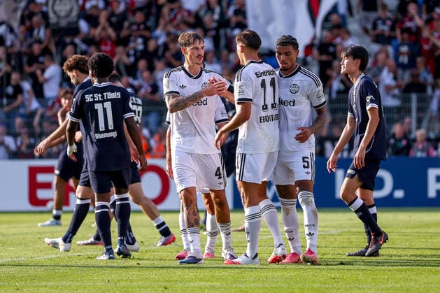 21.08.2026, Fußball, SC St. Tönis - Eintracht Frankfurt, 1. Runde DFB-Pokal 2026 27, Grotenburg-Stadion in Krefeld, Saison 2026 2027: Torjubel nach dem Tor zum 9:0 durch Torschütze Younes Ebnoutalib (Eintracht Frankfurt 11) zusammen mit Robin Koch (Eintracht Frankfurt 04) Otavio Galdino Fernandes(Eintracht Frankfurt 05) DFB regulations prohibit any use of photographs as image sequences and or quasi-video. Nordrhein-Westfalen Deutschland *** August 21, 2026, Soccer, SC St. Tönis vs. Eintracht Frankfurt, First Round of the 2026–27 DFB Cup, Grotenburg Stadium in Krefeld, 2026–2027 season: Goal celebration after the 9–0 goal by scorer Younes Ebnoutalib (Eintracht Frankfurt 11) together with Robin Koch (Eintracht Frankfurt 04) and Otavio Galdino Fernandes (Eintracht Frankfurt 05). DFB regulations prohibit any use of photographs as image sequences and or quasi-video in North Rhine-Westphalia, Germany