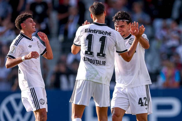 21.08.2026, Fußball, SC St. Tönis - Eintracht Frankfurt, 1. Runde DFB-Pokal 2026 27, Grotenburg-Stadion in Krefeld, Saison 2026 2027: Torjubel nach dem Tor zum 6:0 durch Torschütze Can Uzun (Eintracht Frankfurt 42) zusammen mit Younes Ebnoutalib (Eintracht Frankfurt 11) Ayoube Amaimouni-Echghouyab (Eintracht Frankfurt 29) DFB regulations prohibit any use of photographs as image sequences and or quasi-video. Nordrhein-Westfalen Deutschland *** August 21, 2026, Soccer, SC St. Tönis vs. Eintracht Frankfurt, 1st Round of the 2026–27 DFB Cup, Grotenburg Stadium in Krefeld, 2026–2027 season: Goal celebration after the 6–0 goal scored by Can Uzun (No. 42), Eintracht Frankfurt, together with Younes Ebnoutalib (No. 11), Eintracht Frankfurt, and Ayoube Amaimouni Echghouyab (No. 29), Eintracht Frankfurt. DFB regulations prohibit any use of photographs as image sequences and or quasi-video—North Rhine-Westphalia, Germany