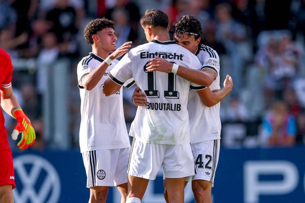 21.08.2026, Fußball, SC St. Tönis - Eintracht Frankfurt, 1. Runde DFB-Pokal 2026 27, Grotenburg-Stadion in Krefeld, Saison 2026 2027: Torjubel nach dem Tor zum 6:0 durch Torschütze Can Uzun (Eintracht Frankfurt 42) zusammen mit Younes Ebnoutalib (Eintracht Frankfurt 11) Ayoube Amaimouni-Echghouyab (Eintracht Frankfurt 29) DFB regulations prohibit any use of photographs as image sequences and or quasi-video. Nordrhein-Westfalen Deutschland *** August 21, 2026, Soccer, SC St. Tönis vs. Eintracht Frankfurt, 1st Round of the 2026–27 DFB Cup, Grotenburg Stadium in Krefeld, 2026–2027 season: Goal celebration after the 6–0 goal scored by Can Uzun (No. 42), Eintracht Frankfurt, together with Younes Ebnoutalib (No. 11), Eintracht Frankfurt, and Ayoube Amaimouni Echghouyab (No. 29), Eintracht Frankfurt. DFB regulations prohibit any use of photographs as image sequences and or quasi-video—North Rhine-Westphalia, Germany