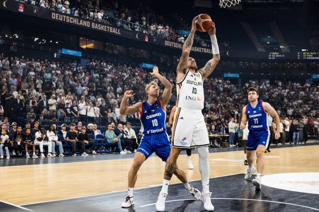 HAMBURG, GERMANY - AUGUST 21: Daniel Theis (Germany, 10) controls the ball against Vojtech Sykora (Czechia, 10) during a Turkish Airlines Basketball Supercup match between Germany vs. Czechia at Barclays Arena on August 21, 2026 in Hamburg, Germany. Hamburg Germany Copyright: xSteffiexWunderlx