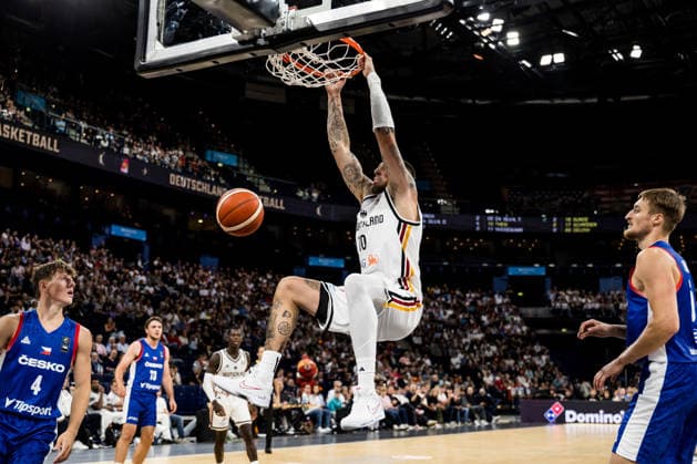 HAMBURG, GERMANY - AUGUST 21: Daniel Theis (Germany, 10) hanging on the rim after a dunk during a Turkish Airlines Basketball Supercup match between Germany vs. Czechia at Barclays Arena on August 21, 2026 in Hamburg, Germany. Hamburg Germany Copyright: xSteffiexWunderlx