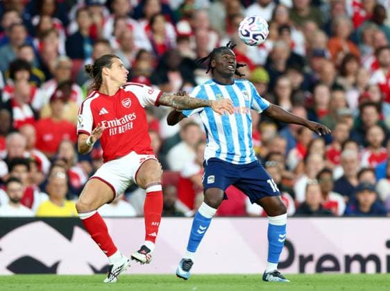 Loum Tchaouna of Coventry City in action against Riccardo Calafioli of Arsenal during the Premier League match between Arsenal and Coventry City at Emirates Stadium on August 21, 2026 in London, England. Arsenal v Coventry City, Premier League Football, Football, Emirates Stadium, London, UK - 21 Aug 2026London Emirates Stadium United Kingdom EDITORIAL USE ONLY No use with unauthorised audio, video, data, fixture lists, club league logos or live services. Online in-match use limited to 120 images, no video emulation. No use in betting, games or single club league player publications.  Copyright: xKieranxMcManus Shutterstockx 17111303aq