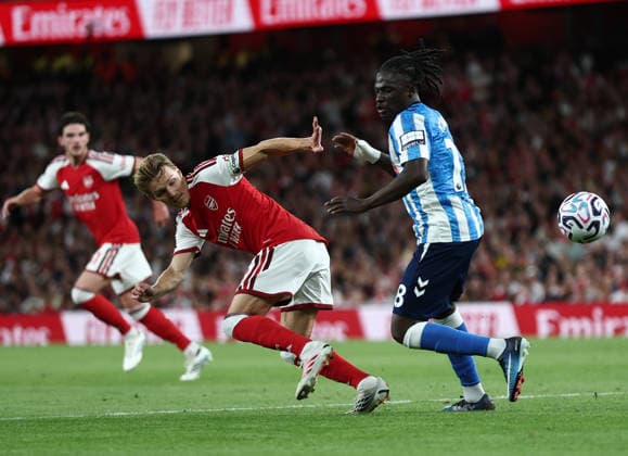 London, England, 21st August 2026. Martin Odegaard of Arsenal and Loum Tchaouna of Coventry City during the Arsenal vs Coventry City Premier League match at the Emirates Stadium, London. Picture credit should read: David Klein Sportimage EDITORIAL USE ONLY. No use with unauthorised audio, video, data, fixture lists, club league logos or live services. Online in-match use limited to 120 images, no video emulation. No use in betting, games or single club league player publications. SPI_066_DK_Arsenal_Coventry SPI-4924-0066