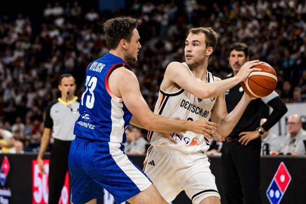 HAMBURG, GERMANY - AUGUST 21: Malte Delow (Germany, 20) controls the ball against Frantisek Rylich (Czechia, 73) during a Turkish Airlines Basketball Supercup match between Germany vs. Czechia at Barclays Arena on August 21, 2026 in Hamburg, Germany. Hamburg Germany Copyright: xSteffiexWunderlx