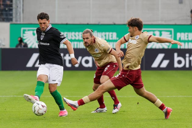21.08.2026, xgrfx, Fussball DFB Pokal 1.Runde, Preußen Münster - Karlsruher SC v.l. Haralambos Makridis (Preußen Münster), Sebastian Jung, Rafael Pinto Pedrosa (Karlsruher SC) (DFL DFB REGULATIONS PROHIBIT ANY USE OF PHOTOGRAPHS as IMAGE SEQUENCES and or QUASI-VIDEO) Münster *** August 21, 2026, xgrfx, Soccer, DFB Cup 1st Round, Preußen Münster vs. Karlsruher SC, by Haralambos Makridis, Preußen Münster, Sebastian Jung, Rafael Pinto Pedrosa, Karlsruher SC. DFL and DFB regulations prohibit any use of photographs as image sequences and or quasi-video. Münster