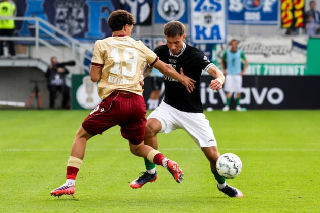 21.08.2026, xgrfx, Fussball DFB Pokal 1.Runde, Preußen Münster - Karlsruher SC v.l. Louey Ben Farhat (Karlsruher SC), Louis Kolbe (Preußen Münster) (DFL DFB REGULATIONS PROHIBIT ANY USE OF PHOTOGRAPHS as IMAGE SEQUENCES and or QUASI-VIDEO) Münster *** August 21, 2026, xgrfx, Soccer, DFB Cup First Round, Preußen Münster vs. Karlsruher SC, Louey Ben Farhat (Karlsruher SC), Louis Kolbe (Preußen Münster). DFL and DFB regulations prohibit any use of photographs as image sequences and or quasi-video. Münster
