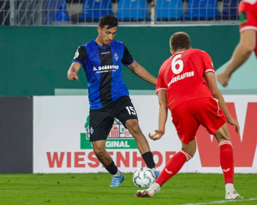 Im Bild: v.li. Claudio Kammerknecht (SV Waldhof Mannheim 07, 15) am Ball gegen Fabian Kunze (1. FC Kaiserslautern, 6) 21.08.2026, SV Waldhof Mannheim 07 - 1. FC Kaiserslautern, DFB-Pokal, 1. Runde, Deutschland, Mannheim, Carl-Benz-Stadion, DFL REGULATIONS PROHIBIT ANY USE OF PHOTOGRAPHS AS IMAGE SEQUENCES AND OR QUASI-VIDEO. *** Pictured from left: Claudio Kammerknecht (SV Waldhof Mannheim 07), No. 15, with the ball against Fabian Kunze (1. FC Kaiserslautern), No. 6, on August 21, 2026, SV Waldhof Mannheim 07 vs. 1 FC Kaiserslautern, DFB Cup, 1st Round, Germany, Mannheim, Carl Benz Stadium; DFL regulations prohibit any use of photographs as image sequences and or quasi-video Copyright: HMBxMedia xJulienxBecker
