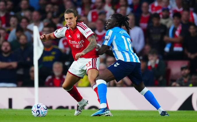 Riccardo Calafiori of Arsenal and Loum Tchaouna of Coventry City Arsenal v Coventry City, Premier League Football, Football, Emirates Stadium, London, UK - 21 Aug 2026London Emirates Stadium United Kingdom EDITORIAL USE ONLY No use with unauthorised audio, video, data, fixture lists, club league logos or live services. Online in-match use limited to 120 images, no video emulation. No use in betting, games or single club league player publications.  Copyright: xJavierxGarcia Shutterstockx 17111304eu