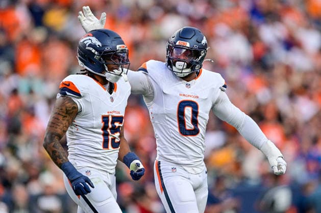 DENVER, CO - AUGUST 21: Denver Broncos linebacker Jonathon Cooper (0) and linebacker Nik Bonitto (15) celebrate after a defensive play in the first quarter during a preseason game between the Green Bay Packers and the Denver Broncos at Empower Field at Mile High on August 21, 2026 in Denver, Colorado. (Photo by Dustin Bradford Icon Sportswire) NFL, American Football Herren, USA AUG 21 Packers at Broncos EDITORIAL USE ONLY Icon132260821022