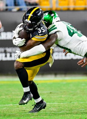 New York Jets Jaden Keller tackles Pittsburgh Steelers running back Lew Nichols (35) after a gain five yards during the third quarter of the Steelers pre-season 17-0 lost to the New York Jets at Acrisure Stadium on Thursday, Friday, Aug. 21, 2026 in Pittsburgh.  PIT2026082113 ARCHIExCARPENTER