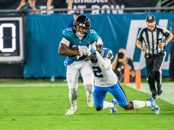 Aug 21, 2026; Jacksonville, Florida, USA; Jacksonville Jaguars wide receiver Josh Cameron (19) is tackled after getting the first down by Carolina Panthers cornerback Mike Jackson (2) during the first half of preseason game at Everbank Stadium. Mandatory Credit: -Cal Media NFL, American Football Herren, USA 2026: Panthers Vs Jaguars AUG 21  - ZUMAcg2_ 20221124_faf_cg2_023 Copyright: xRomeoxGuzmanx