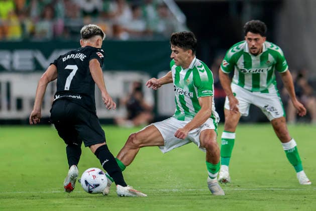 Real Betis Balompie v Real Sociedad - LaLiga EA Sports 2026 27 Marc Roca of Real Betis competes for the ball with Ander Barrenetxea of Real Sociedad during the La Liga EA Sports match between Real Betis and Real Sociedad at Stadium La Cartuja in Seville, Spain, on August 21, 2026. Seville Spain  Copyright: xJosexLuisxContrerasx originalFilename:joseluiscontreras-realbeti260821_npO2M.jpg