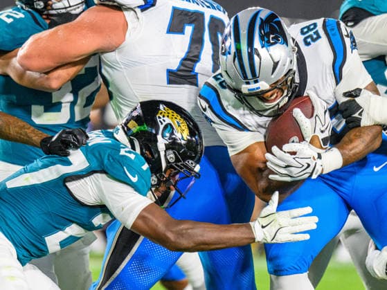 Aug 21, 2026; Jacksonville, Florida, USA; Carolina Panthers running back AJ Dillon (28) is tackled by Jacksonville Jaguars safety Caleb Ransaw (27) during the first half of preseason game at Everbank Stadium. Mandatory Credit: -Cal Media NFL, American Football Herren, USA 2026: Panthers Vs Jaguars AUG 21  - ZUMAcg2_ 20221124_faf_cg2_064 Copyright: xRomeoxGuzmanx