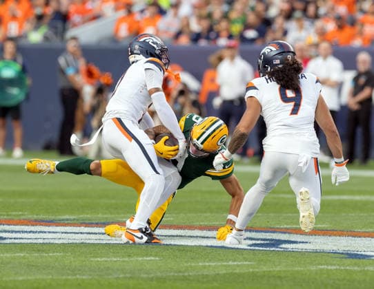 August 21, 2026, Denver, Colorado, USA: Packers WR CHRISTIAN WATSON catches a pass with Broncos CB PAT SURTAIN II who tries to strip the ball during the 1st. Half at Empower Field at Mile High Friday evening. Packers beat the Broncos in Pre-Season 33-13. Credit Image: ZUMA Press Wire) Denver USA - ZUMAav4_ 20260821_zaf_av4_016 Copyright: xHectorxAcevedox