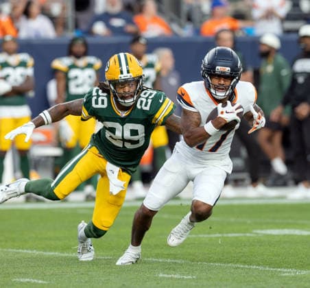 August 21, 2026, Denver, Colorado, USA: Broncos WR JAYLEN WADDLE runs for big yardage aft a catch with Packers S XAVIER MCKINNEY closes in during the 1st. Half at Empower Field at Mile High Friday evening. Packers beat the Broncos in Pre-Season 33-13. Credit Image: ZUMA Press Wire) Denver USA - ZUMAav4_ 20260821_zaf_av4_014 Copyright: xHectorxAcevedox