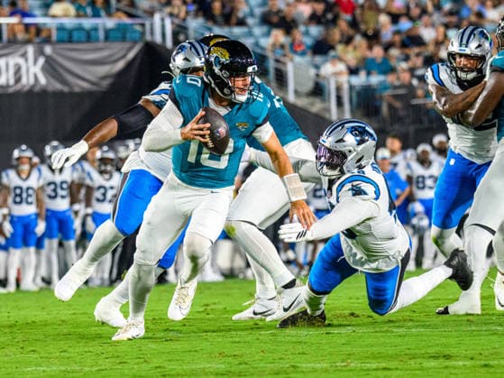 Aug 21, 2026; Jacksonville, Florida, USA; Jacksonville Jaguars quarterback Carter Bradley (10) is chased out of the pocket by Carolina Panthers linebacker Thomas Incoom (48) during the first half of preseason game at Everbank Stadium. Mandatory Credit: -Cal Media Jacksonville USA - ZUMAcg2_ 20221124_faf_cg2_053 Copyright: xRomeoxGuzmanx