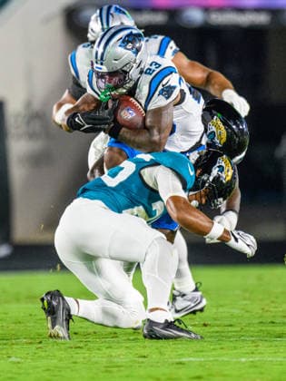 Aug 21, 2026; Jacksonville, Florida, USA; Carolina Panthers running back Trevor Etienne (23) is tackled by Jacksonville Jaguars safety Rayuan Lane III (25) during the first half of preseason game at Everbank Stadium. Mandatory Credit: -Cal Media Jacksonville USA - ZUMAcg2_ 20221124_faf_cg2_063 Copyright: xRomeoxGuzmanx