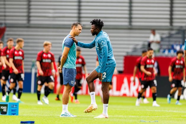 WIESBADEN, GERMANY - AUGUST 22: Edmond Tapsoba (Bayer 04 Leverkusen, 12) warming up before the first-round match between SV Wehen Wiesbaden vs. Bayer 04 Leverkusen at Brita Arena of the German Cup on August 22, 2026 in Wiesbaden, Germany. DFL REGULATIONS PROHIBIT ANY USE OF PHOTOGRAPHS AS IMAGE SEQUENCES AND OR QUASI-VIDEO. Hessen Germany Copyright: xStephanxHahnex