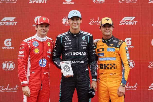 ZANDVOORT - (lr) Charles Leclerc (Scuderia Ferrari HP) with second place, George Russell (Mercedes-AMG PETRONAS Formula One Team) with first place, and Lando Norris (McLaren Mastercard F1 Team) with third place in the sprint race pose after the sprint race, ahead of the Dutch F1 Grand Prix at the Circuit Zandvoort. SEM VAN DER WAL ANP xVIxANPxSportx xxANPxIVx 565996058 originalFilename: 565996058.jpg