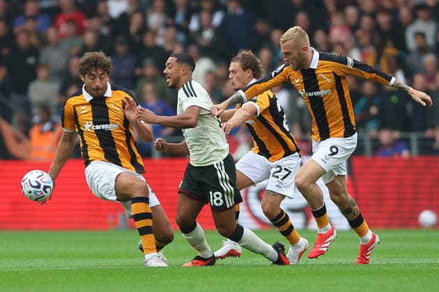 RECORD DATE NOT STATED 22nd August 2026; MKM Stadium, Hull, Yorkshire, England; Premier League Football, Hull City versus Manchester United, ManU Manchester United s Youri Tielemans is fouled by Hull City s Oli McBurnie and Matt Crooks DavidxLofthouse