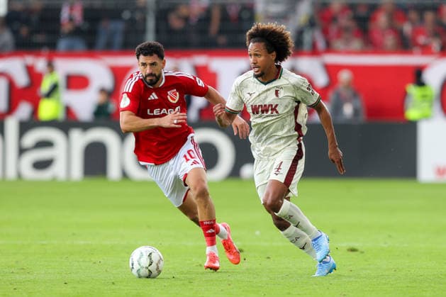 22.08.2026, xtgx, Fussball - DFB Pokal 1.Runde Energie Cottbus - FC Augsburg emspor, v.l. Tolcay Cigerci (Cottbus, 10), Han Noah Massengo (Augsburg, 4) Zweikampf, Duell, Kampf, tackle (DFL DFB REGULATIONS PROHIBIT ANY USE OF PHOTOGRAPHS as IMAGE SEQUENCES and or QUASI-VIDEO) Cottbus *** August 22, 2026, xtgx, Soccer DFB Cup 1st Round Energie Cottbus vs. FC Augsburg emspor, from left: Tolcay Cigerci (Cottbus), 10, Han Noah Massengo (Augsburg), 4: Tackle, duel, battle, DFL DFB REGULATIONS PROHIBIT ANY USE OF PHOTOGRAPHS as IMAGE SEQUENCES and or QUASI-VIDEO Cottbus