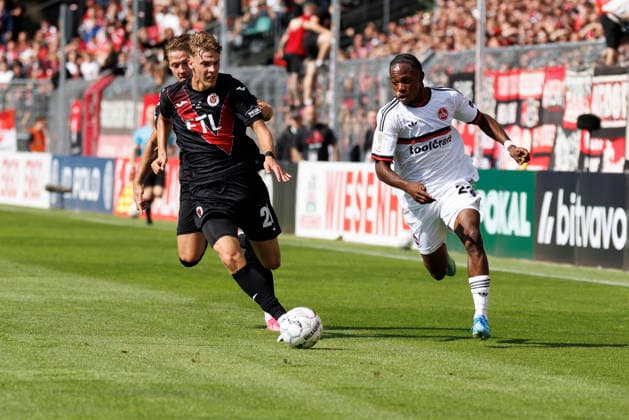 KOELN, GERMANY - AUGUST 22, 2026: Mohamed Alì Zoma (1. FC Nuernberg, 23), Niklas Swider (Viktoria Koeln, 20) during the DFB-Cup match between Viktoria Koeln vs. 1. FC Nuernberg at the Sportpark Hoehenberg on August 22, 2026 in Koeln, Germany. DFL REGULATIONS PROHIBIT ANY USE OF PHOTOGRAPHS AS IMAGE SEQUENCES AND OR QUASI-VIDEO. Nordrhein-Westfalen Germany Copyright: xAxelxKohringx