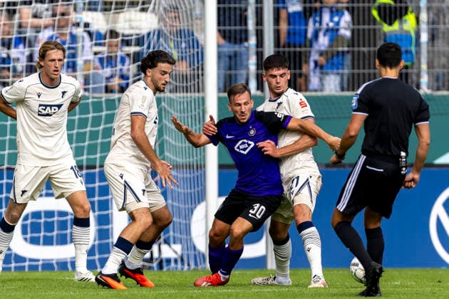 GER, Aue, Fussball, DFB-Pokal, 1. Hauptrunde, FC Erzgebirge Aue vs. TSG 1899 Hoffenheim im Bild v.l.: Simon Skarlatidis (FC Erzgebirge Aue 30), Albian Hajdari (TSG Hoffenheim 21), Zweikampf 22.08.2026, EINS Erzgebirgsstadion Aue DFB REGULATIONS PROHIBIT ANY USE OF PHOTOGRAPHS AS IMAGE SEQUENCES AND OR QUASI-VIDEO, *** GER, Aue, Soccer, DFB Cup, First Round, FC Erzgebirge Aue vs. TSG 1899 Hoffenheim (pictured, from left): Simon Skarlatidis (FC Erzgebirge Aue) 30, Albian Hajdari, TSG Hoffenheim 21, tackle, August 22, 2026, EINS, Erzgebirgsstadion Aue. DFB regulations prohibit any use of photographs as image sequences and or quasi-video, Copyright: HMBxMedia PaulxFritz