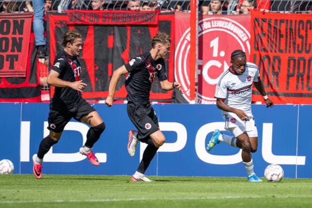 Zweikampf zwischen Tobias Eisenhut (Viktoria Koeln, 06), Niklas Swider (Viktoria Koeln, 20) und Mohamed Ali Zoma (1. FC Nuernberg, 23). Viktoria Koeln vs. 1. FC Nuernberg, Fussball, DFB-Pokal, 1. Runde, Saison 2026 2027, 22.08.2026 DFL DFB Regulations prohibit any use of Photographs as image sequences and or Quasivideo Viktoria Koeln vs. 1. FC Nuernberg, Fussball, DFB-Pokal, 1. Runde, Saison 2026 2027, 22.08.2026 Koeln *** Tackle between Tobias Eisenhut of Viktoria Cologne, 06, Niklas Swider (Viktoria Cologne), 20, and Mohamed Ali Zoma (1. FC Nuremberg), 23—Viktoria Cologne vs. 1. FC Nuremberg, Soccer, DFB Cup, First Round, 2026–2027 Season, August 22, 2026 DFL DFB regulations prohibit any use of photographs as image sequences and or quasi-video Viktoria Cologne vs. 1. FC Nuremberg, soccer, DFB Cup, 1st round, 2026–2027 season, August 22, 2026, Cologne Copyright: xEibner-Pressefoto ThomasxHaeslerx EP_THR